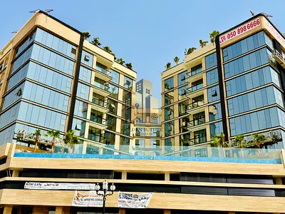 Brand new building / front of Sharjah mosque / outstanding finishing / with pool & parking