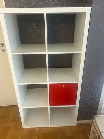 Modern White Bookshelf with Red Accent