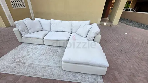 Modular feather filled sofa with footstool