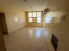 One-bedroom apartment with a living room in Al Rawda 3, Ajman, spacious with 2 bathrooms, prime loca