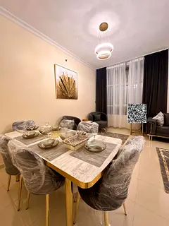 Two bedrooms and a living room with a balcony, parking, and furnishings