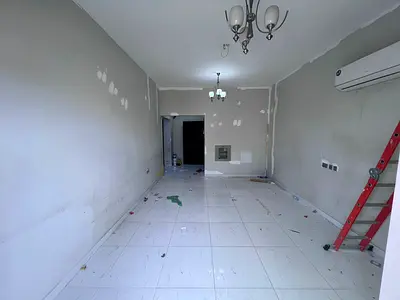 Annual rent in Al Rawdha Ajman, one-bedroom apartment with living room, 30K AED on 6 payments, spacious layout, excellent divisions, balcony with amaz