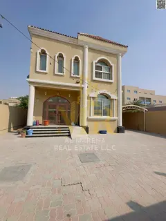 A stunning villa for sale in Ajman, two floors plus a rooftop terrace in the Al Rawda area, at a spe