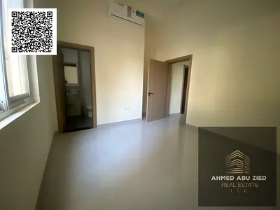 For annual rent in Ajman, Al Rawda 1 – First occupancy, one-bedroom apartment with a living room, two bathrooms, and split AC, ground floor, in a prim