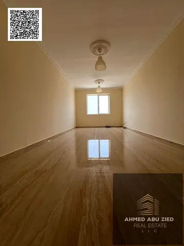 For annual rent in Ajman, Al Nuaimiya 3 – a two-bedroom apartment with a living room, two bathrooms, and free parking, with a comfortable layout and a