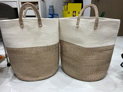 Woven baskets made of cotton rope and jute are perfect for storing laundry, toys, or as stylish home