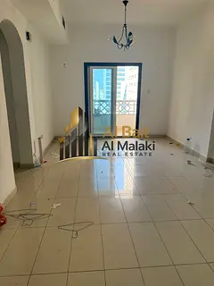A room and a lounge with a balcony in Al Qasba, a large area, an open view and facilities in payment