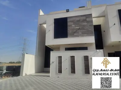 فيلا تاون هاوس فاخرة للبيع في الحليو 2 – عجمان | 5 غرف نوم ماستر، صالة ومجلس، مطبخ مجهز، غرفة خادمة، جلسة خارجية ورووف