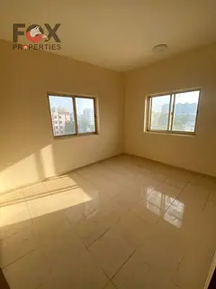 Two bedrooms and a living room for annual rent in Al Rashidiya 2 area, next to Falcon Towers, open v
