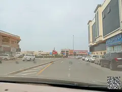 Commercial land on a street and alley, near Sheikh Khalifa Street, Al Rawda 3, Ajman.