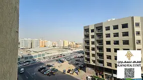 Two-Bedroom Apartment with Living Room for Sale in Garden City Towers, Ajman, with Private Parking.