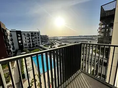 Pool view with free parking, free gym and swimming pool, built-in wardrobes, and two balconies with