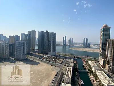 For lovers of high views and distinctive view, an apartment for sale with a panoramic view in Sharjah Al Majaz 3 area overlooking Al Qasba Canal and A