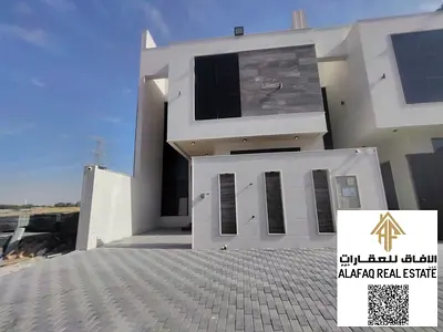 فيلا تاون هاوس فاخرة للبيع في الحليو 2 بعجمان بتصميم عصري وتشطيب راقٍ ومساحات واسعة تشمل خمس غرف ماستر وروف مميز وجلسة خارجية في موقع حيوي مناسب للسكن