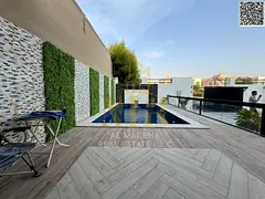 Luxury villa for sale in Al Muwaihat, Ajman, with a swimming pool, priced inclusive of electricity,