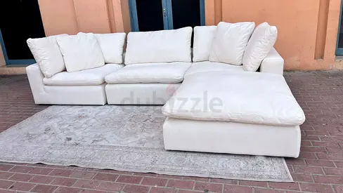 Modular feather filled sofa with footstool marina home