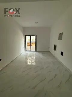 Room and hall for annual rent in Al Karama area, near to Ajman Corniche, open view, balcony, 2 bathr