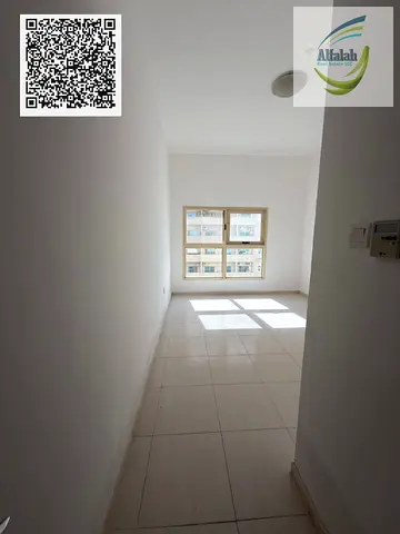 Spacious 1BHK with Parking | 1,000 Sq Ft | Balcony | Lilies Tower | AED 30K