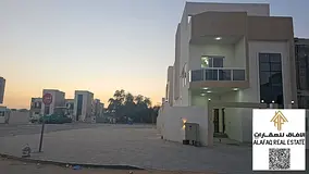 Corner villa for sale in Al Helio, Ajman with a large setback, 4 bedrooms, maid’s room, 2 rooftops