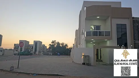Corner villa for sale in Al Helio, Ajman with a large setback, 4 bedrooms, maid’s room, 2 rooftops, including electricity, water, and registration fee