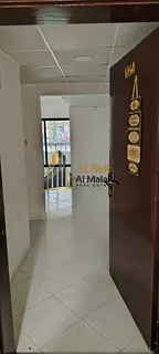 Two bedrooms and a living room in Al Majaz 3 with a balcony, two bathrooms, and a very spacious area