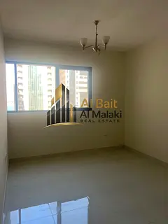 Spacious one-bedroom apartment with living room and balcony for rent in Al Taawun, located directly