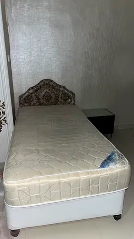 Single Bed , closet, and bedside table