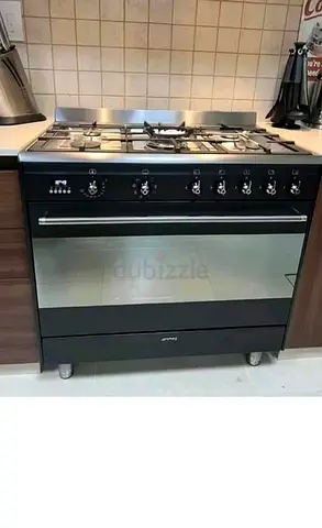 Smeg black top gas with electric oven 90cm