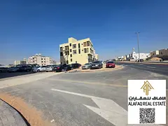 Corner residential–commercial plot on two streets in Al Amerah, second row from the main road, ver