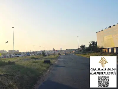 أرض استثمارية للبيع في عجمان العالية جلوبال سيتي على شارع رئيسي مباشر بتصريح سكني تجاري G+15