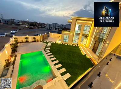 Own a villa with a land area of ​​10,000 sq ft, directly opposite Al Hamidiya Park, with a private pool, including air conditioning, electricity, and
