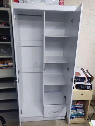 Stylish White Wardrobe with Shelves and Drawer