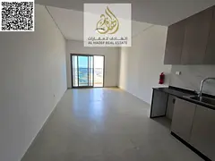 First-time occupancy studio apartment with balcony, parking, gym, and swimming pool in Al Amerah, on