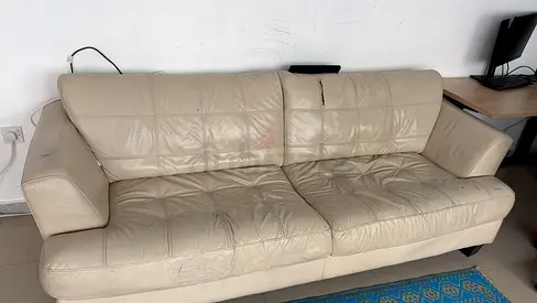 Used Leather Sofa in Need of Care