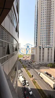 An apartment in Al Khan featuring a direct view of Al Khan Lake and another view of the Qasba Canal.