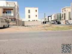 Residential land with a 21-meter setback on the main road in Al Zahia area.