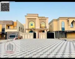 Villa for sale in Ajman, Al Helio area. 7 master bedrooms, majlis, living room, and maid's room.