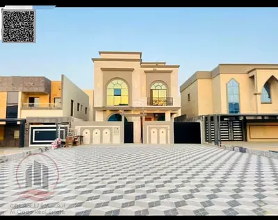 Villa for sale in Ajman, Al Helio area. 7 master bedrooms, majlis, living room, and maid's room. Freehold ownership for all nationalities. Bank financ