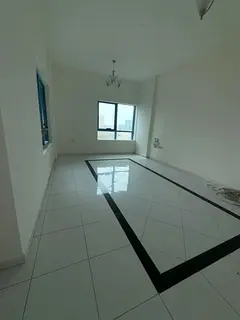 For rent in Al Qasba Corniche: spacious 1BR + hall with balcony, 2 bathrooms, prime location near se