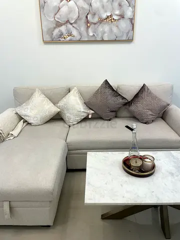 Pan emirates Beige L-Shaped Sofa with Decorative Cushions