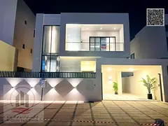 For sale, a villa in Ajman Al Zahia, 5 master bedrooms, a living room, a hall, and a maid’s room, 