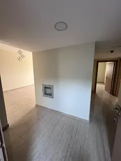 Two bedrooms and a spacious living room with a master bathroom