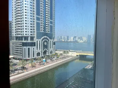Free parking | Gym - pool | Balcony with Qasba view | Prime location near Qasba Canal - Corniche | Family tower | Central AC - gas