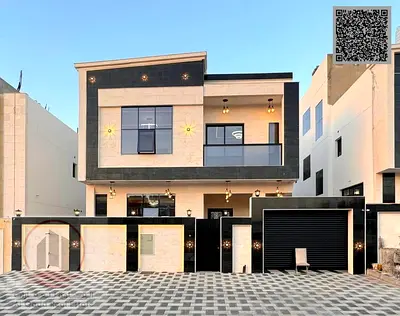Villa for sale in Ajman, Al Helio 2, including registration fees. 6 master bedrooms, majlis, living room, roof terrace, and maid's room. Freehold owne
