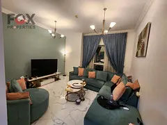 1BR apartment for sale in Oasis Towers Ajman, furnished and ready to move, prime lively location nea