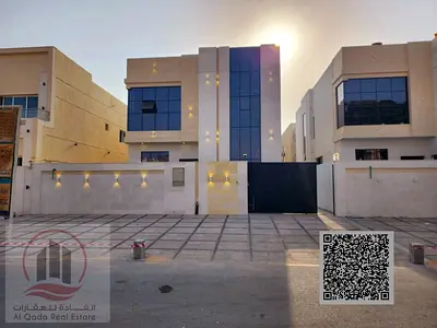For sale, a villa in Ajman Al Helio, 5 master bedrooms, a living room, a hall, a maid’s room, a swimming pool, and a roof (including registration fees