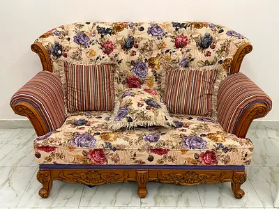 Beautifully Crafted Floral Couch with Decorative Pillows