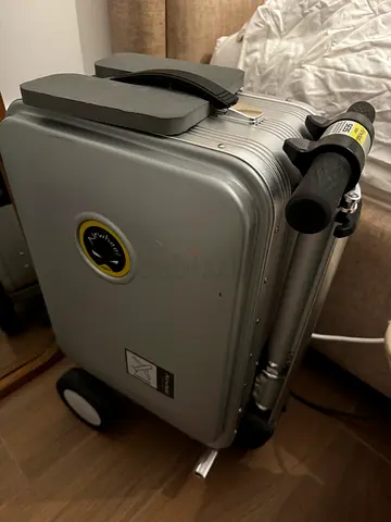 2 Airwheel Smart Riding Suitcases (SE3 type) in grey and silver