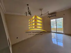A large room and living room with a balcony, next to the Corniche in Ajman.
