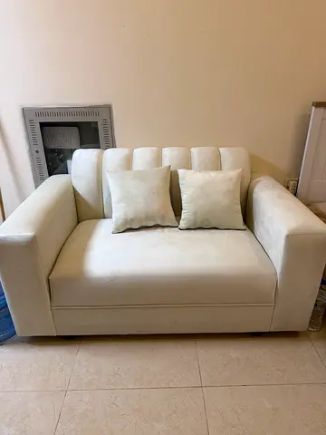 Two seater sofa with cushions